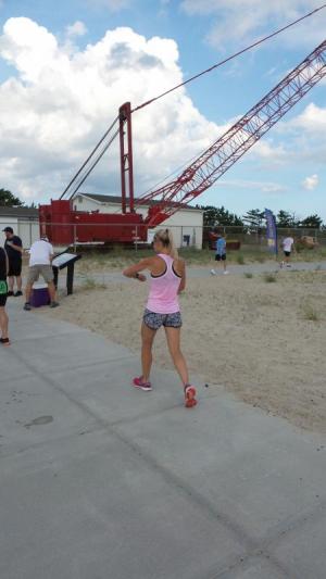 First place in the female division, Kristin Lopa, walks off the pain after finishing.