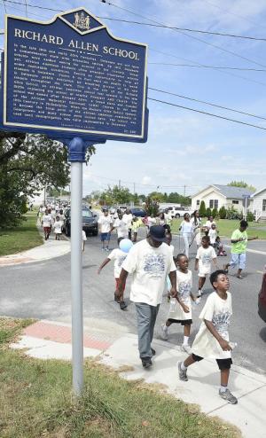 Marchers head to the Richard Allen school for food, games, music, and entertainment.