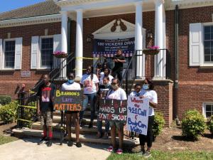 Brandon Roberts’ family in front of city hall in Milford.