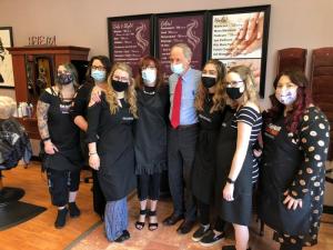 U.S. Sen. Tom Carper pauses during his visit for a photo with the staff of Puttin’ On The Ritz.