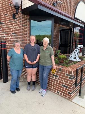 Proud of their completed planting work are (l-r) Mary Ann Warrington, Anna Fantoli and Kathryn Greig.