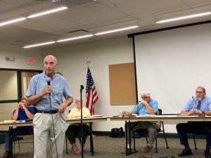Milton Fire Chief Johnny Hopkins testifies before the Milton Special Review Committee Aug. 25. Behind Hopkins are (l-r) Public Works Director Greg Wingo, Councilwoman Lee Revis-Plank, Planning and Zoning Commission Chairman Richard Trask and Committee Chairman John Collier. RYAN MAVITY PHOTO