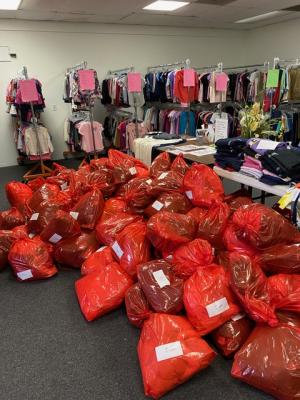 Newly delivered donations from Mountaire await sorting in the Clothing Our Kids volunteer center.