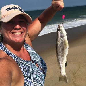Adrienne Talabisco with a nice sized kingfish caught on a DS Custom Tackle top and bottom rig, and Fishbites.