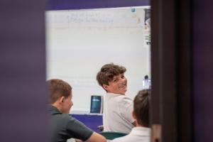 Middle school student Eric Murray takes part in a computer class at the Milton Campus.