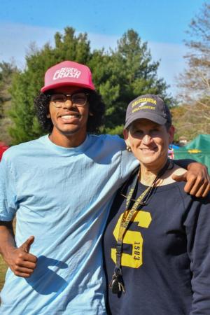 Ian Hayes of Milford and Shelly Smith, former Caesar Rodney star, find instant friendship at the state cross country meet.