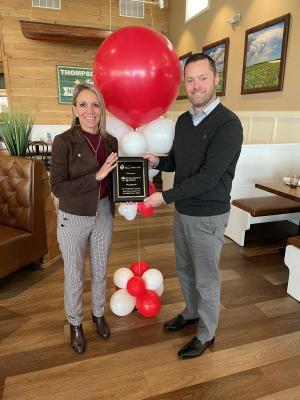 Sheila Cisco, left, accepts the third-place plaque for the County Bank team that raised $22,000. Presenting the award is Dave Morris, American Heart Association executive director.