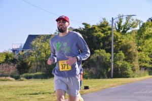 Chris Kirchner clocks a time of 18:31 in the 5K.