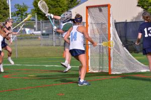 Anna Lopez makes a jump save.