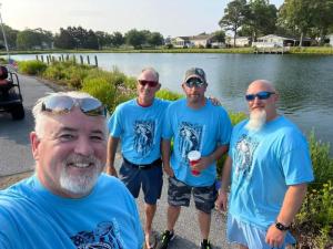 Judges Ed Charlier, Chuck Wallace, Ron Scarpetti and Bryan Richmond soak up the sun during the first Pond Pounder at Paradise Grill June 17.