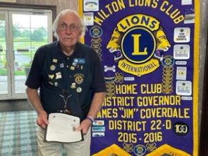 The Lion Vision Research Foundation 120 Club Pin was presented to B. Marshall Reynolds.