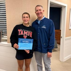 Eve Mundok, left, of Sussex Academy accepts an Extraordinary Smiles Scholarship from Dr. Jonathan Johnson of Johnson Orthodontics.