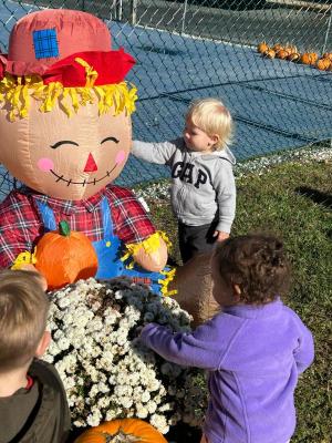 Clay Spicer checks out a friendly scarecrow.
