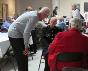 Dinner guests and fellow veterans chatting are (l-r) Richard Bondreski, Capt. Tom Terrell and Charlie Sewell.
