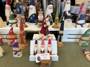 Santa Claus carvings made by Ken Dispoto at Milton Arts Guild’s winter market.