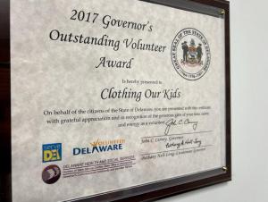 A proclamation from Delaware Gov. John Carney is one of many awards hanging in Bob Blouin’s office that recognize the work done by Clothing Our Kids. BILL SHULL PHOTO