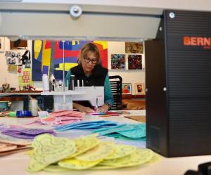Sarah Pavlik stitches felt footprints together in her Lewes studio. The accomplished artist is helping put together the footprint tapestry that will hang in Lewes City Hall in April.