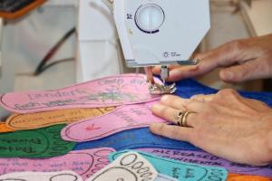 Sarah Pavlik at work linking the felt footprints together.