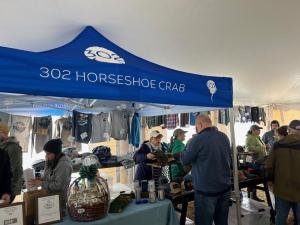 The 302 Horseshoe Crab merch booth was busy during 302 Day in Milton March 2.