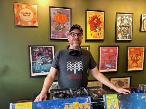 DJ Todd spins and sells vinyl records in the Dogfish Head tasting room.