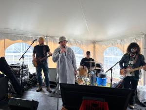 The main event in the outdoor tent was live band karaoke with the Nick Kashmanian Band. Members of the audience were allowed to sign up with their favorite song and front the band. Jeff Evans belts out his version of the Allman Brothers Band’s “Ramblin’ Man.”