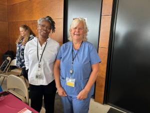 Deb Purnell, left, and Dawn Walsh of Delaware Department of Health and Social Services provide dental care resources.