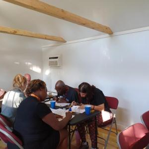 Art session participants begin by tracing designs in pencil.