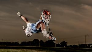 LaCrosse-Player-Jumps-Through-the-Air