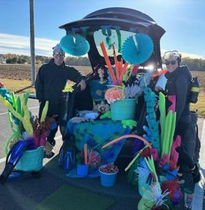 Under the sea was the theme of this elaborately designed trunk belonging to volunteers Michael Kennedy, left, and Corey Kennedy.