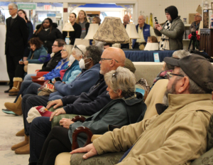 Attendees listen to a tribute offered by Sussex County Habitat for Humanity CEO Kevin Gilmore.