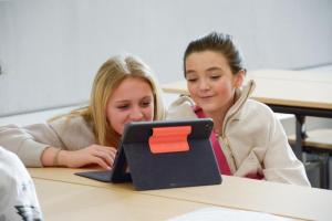 Intrigued by the visual information are Sophia Ruffcorn, left, and Erin Mayo.