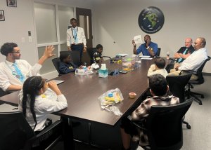 H.O. Brittingham Elementary School’s Guys with Ties students enjoy an engaging presentation from Brian Tatem at Hickman’s Meat Market. Around the table are (clockwise from center front) Gabe Cosme, Jordan Winkfield, E’Maurei Wise, Justin Cureton, Messiah Long, Brian Tatem, Constable George Rath, Jerome Foster, Grayson May and Malachi Juarbe.