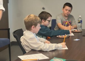 Filing out evaluations of the sausage samples are (l-r) Grayson Briggs, Liam Bayless and Josh Wyatt.