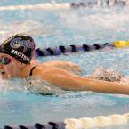 Senior Christine Bristowe scores in the 100 meter butterfly. BY DAN COOK