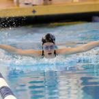Kaitlin Philcox takes fifth place in the 200 meter individual medley. BY DAN COOK