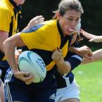 Lindsay Kinsler of the Norfolk Storm stiff-arms her EPRU opponent on the way to a 50-0 win. BY DAN COOK