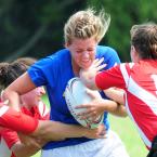UD's 5: Marissa Curti battles through a West Chester tackle. BY DAN COOK