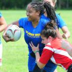 UD's Jessica "Killer" Stecker battles through a West Chester tackle. BY DAN COOK