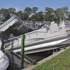 Pontoon boats are piled up on top of one another in the Bayside marina. BY RON MACARTHUR