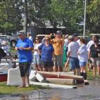 Bayside residents watch as a crane crew removes damaged pontoon boats from the marina. BY RON MACARTHUR