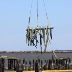 The crane lifts the remaining section. BY MELISSA STEELE