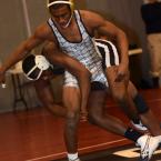 Cape's J.J. Currie escapes a hold by Tech's Dimarco Dorsey and wins a 7-2 decision in the 152-pound class. BY DAN COOK