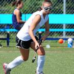 Mariner eighth-grader Lori Ferguson makes a play on a loose ball. BY DAN COOK