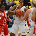 Alyssa Miller battles for a rebound with Smyrna's Nnennaya                   Okorie. BY DAN COOK