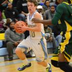 Junior guard Ryan Thornburg makes his move to the hoop. BY DAN COOK