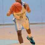 Cape senior guard Tyreik Burton passes down low to David Kwan during the Vikings' win over Indian River. BY DAN COOK