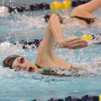 Cape freshman Sarah Rambo swims past the Milford swimmer to touch up for second in the 200-meter freestyle with a 2:17.84. BY DAN COOK