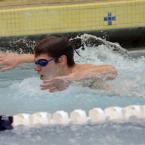Senior Nate Griffith scores valuable top 10 points in the 100-meter butterfly. BY DAN COOK