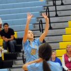Beacon's Jenna Nolan sets a teammate at the net. BY DAN COOK