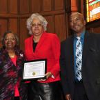 Sister Ardeth Edwards,l, and and Clem Jordan,r, present Rev. Annie Custis a certificate of appreciation of her service as a the worship leader. BY DAN COOK